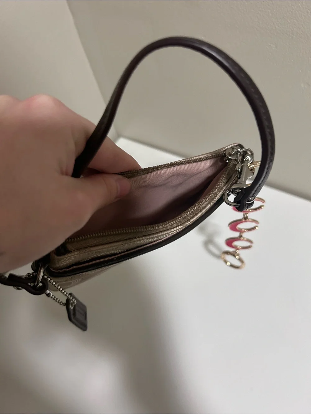 Coach Taupe Signature Canvas Wristlet with Red Charm Accents
